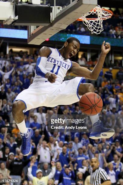 John Wall of the Kentucky Wildcats reacts after he completed a dunk against the Tennessee Volunteers during the semirfinals of the SEC Men's...