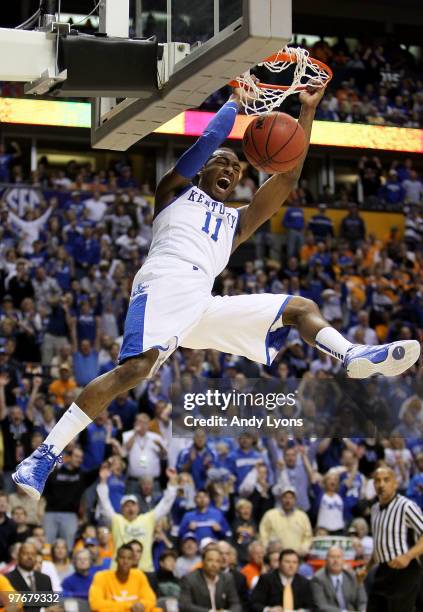 John Wall of the Kentucky Wildcats dunks against the Tennessee Volunteers during the semirfinals of the SEC Men's Basketball Tournament at the...