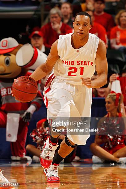 Guard Evan Turner of the Ohio State Buckeyes controls the ball against the Illinois Fighting Illini in the semifinals of the Big Ten Men's Basketball...