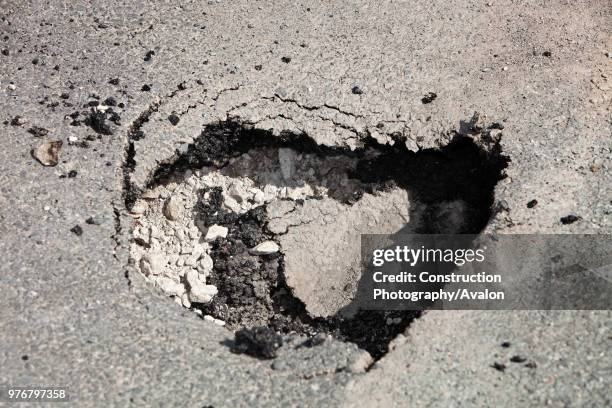 Hole opening up in the road in Ambleside, due to being undermined by flood waters Climate change causes more extreme weather events, which leads to...