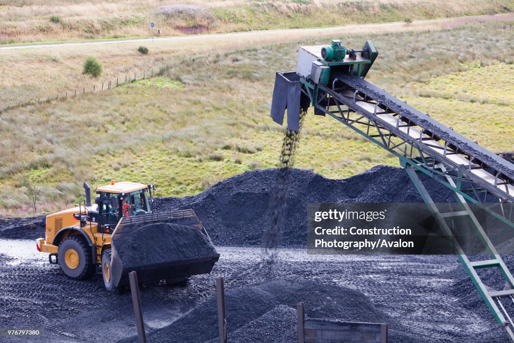 A conveyor belt that takes coal from the Glentaggart open cast coal mine to a road head for onward transport by road in Lanarkshire, Scotland, UK. As well as the disastrous climate change consequences of continuing to mine and burn coal, living close to