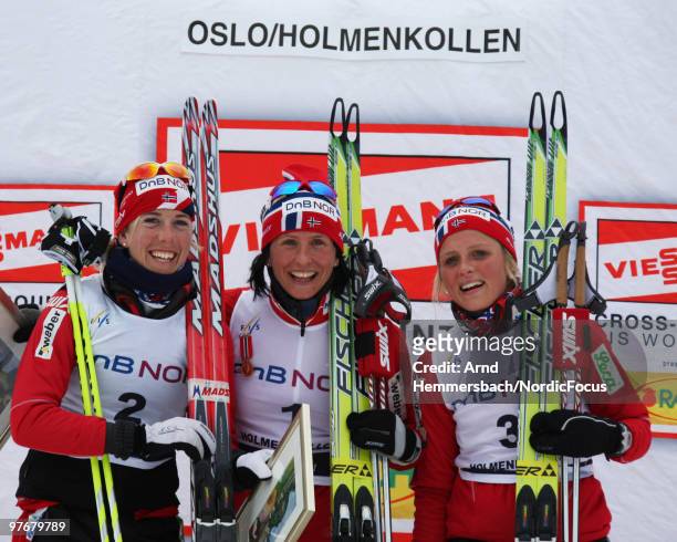 2nd Kristin Steira Stoermer of Norway, 1st Marit Bjoergen of Norway and 3rd Therese Johaug of Norway show emotions after the women's 30km Cross...