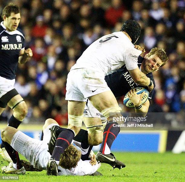 John Barclay of Scotland is tackled by Steven Borthwick of England during the RBS Six Nations match between Scotland and England at Murrayfield...