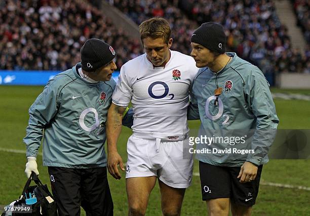 Jonny Wilkinson of England is helped from the pitch with an injury during the RBS Six Nations Championship match between Scotland and England at...