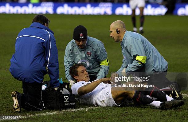 Jonny Wilkinson of England receives treatment for an injury during the RBS Six Nations Championship match between Scotland and England at Murrayfield...