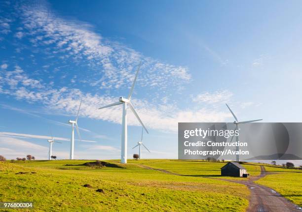 Wind farm on the outskirts of the Lake District with Skiddaw behind, Cumbria, UK.