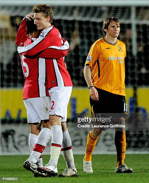 Nicklas Bendtner of Arsenal celebrates victory with Denilson in front of Kevin Kilbane of Hull Cityl during the Barclays Premier League match between...