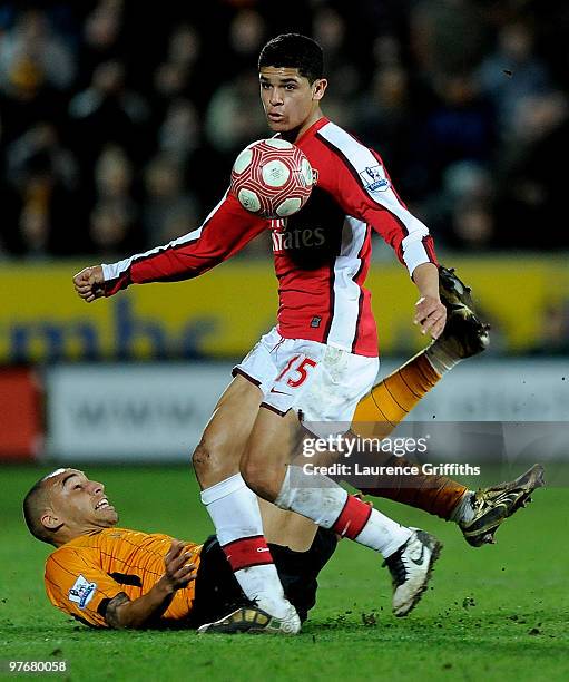 Denilson of Arsenal battles with Craig Fagan of Hull City during the Barclays Premier League match between Hull City and Arsenal at KC Stadium on...