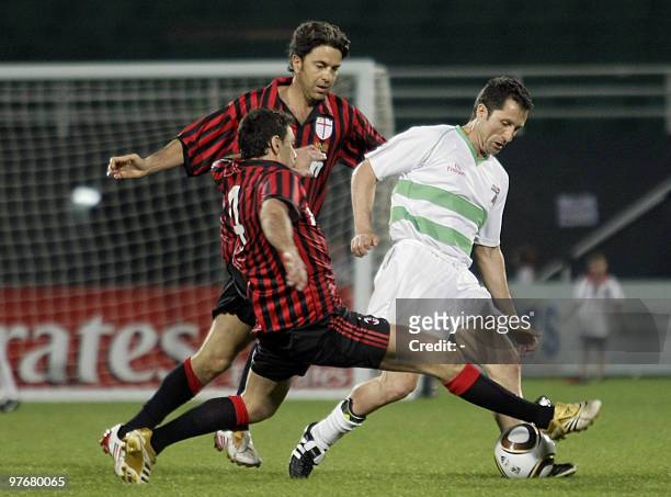 Celtic player John Collins competes with AC Milan players Alessandro Costacurta and Angelo Carbone during the final match of the Emirates Airlines...