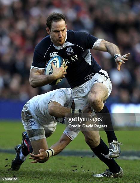 Graeme Morrison of Scotland is tackled during the RBS Six Nations Championship match between Scotland and England at Murrayfield Stadium on March 13,...