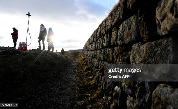 Volunteers prepare to light a beacon on Hadrian's Wall at Steel Rigg Northumberland on March 13, 2010. Hadrian's Wall is being lit from end to end by...