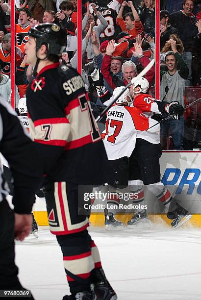 Jeff Carter and Chris Pronger of the Philadelphia Flyers celebrate Pronger's game winning goal with 2 seconds left in the game against the Chicago...