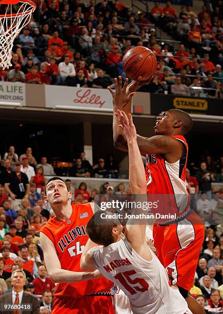 Guard Brandon Paul of the Illinois Fighting Illini takes a shot against the Ohio State Buckeyes in the semifinals of the Big Ten Men's Basketball...