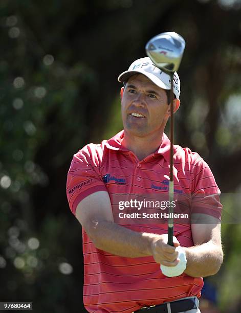 Padraig Harrington of Ireland plays a shot on the fifth hole during round three of the 2010 WGC-CA Championship at the TPC Blue Monster at Doral on...