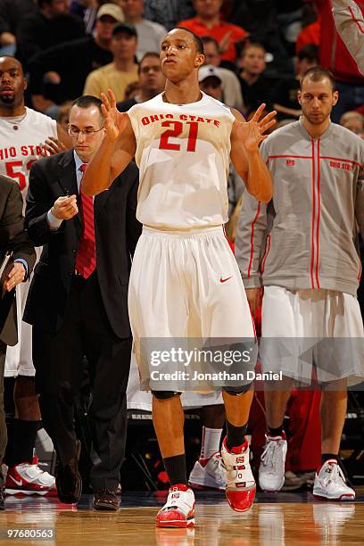 Guard Evan Turner of the Ohio State Buckeyes celebrates after defeating the Illinois Fighting Illini 88-81 in double overtime of the semifinals in...