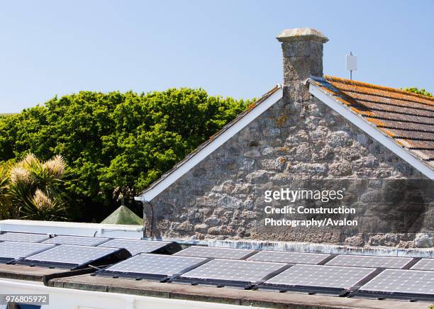 Solar electric panels on the roof of the Tresco and Bryher primary school, Isles of Scilly, UK.