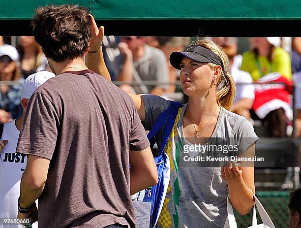 Sasha Vujacic of the Los Angeles Lakers and Maria Shapova of Russia on court at her practice during the BNP Paribas Open on March 13, 2010 in Indian...