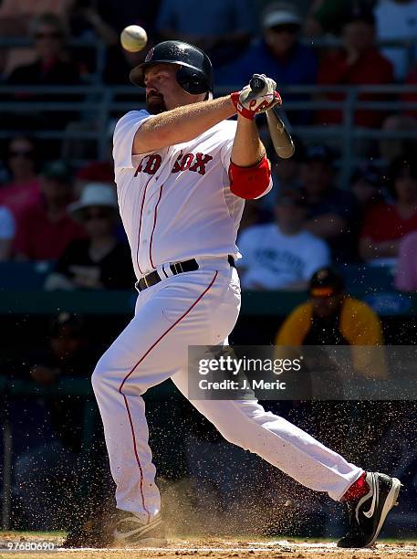 Infielder Kevin Youkilis of the Boston Red Sox fouls off a pitch against the Pittsburgh Pirates during a Grapefruit League Spring Training Game at...