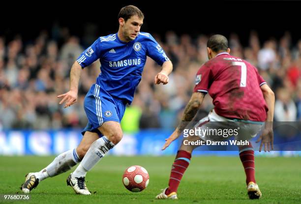 Branislav Ivanovic of Chelsea takes on Keiron Dyer of West Ham during the Barclays Premier League match between Chelsea and West Ham United at...