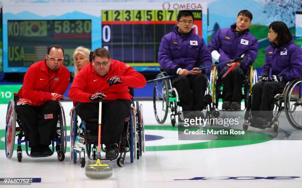 Jim Pierce of United States releases the stone during the Wheelchair Curling Round Robin game between Korea and the United States on day two of the...