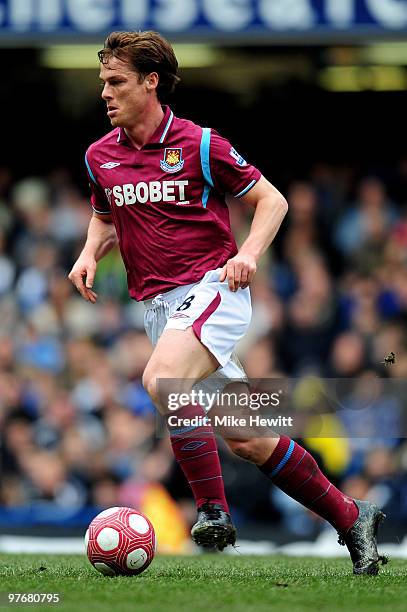 Scott Parker of West Ham runs with the ball during the Barclays Premier League match between Chelsea and West Ham United at Stamford Bridge on March...