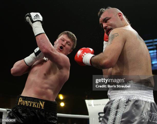 Alexander Povetkin of Russia and Javier Mora of Mexico exchange punches during their Heavyweight fight at the Max-Schmeling-Halle on March 13, 2010...