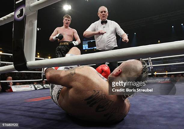 Alexander Povetkin of Russia knocks out Javier Mora of Mexico during their Heavyweight fight at the Max-Schmeling-Halle on March 13, 2010 in Berlin,...
