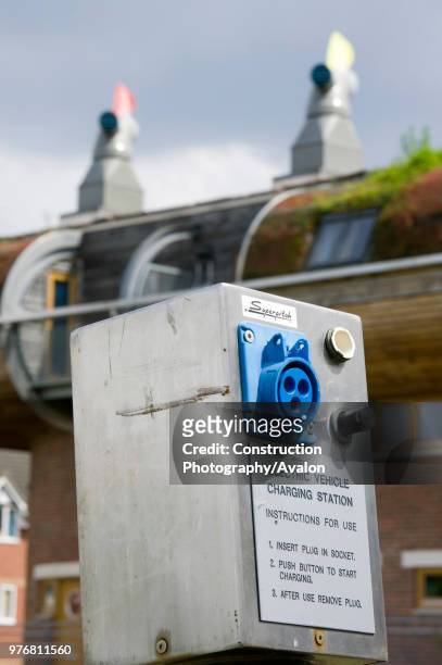 An electric car charging point at Bedzed the UK's largest eco village Beddington London UK.