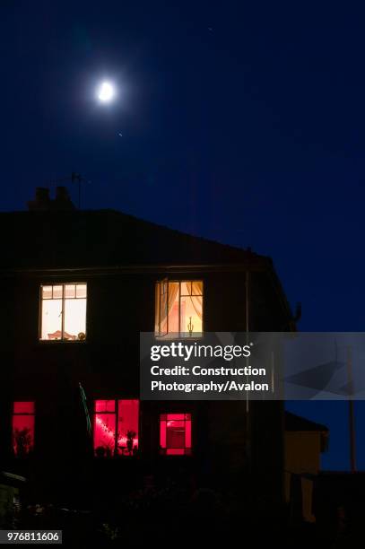 Moon and house at night Ambleside UK.