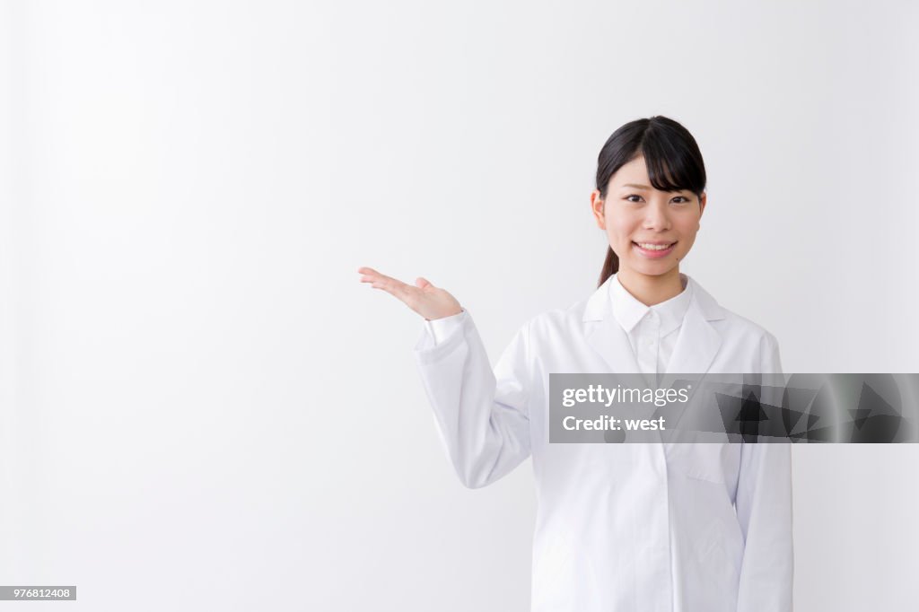 A woman in a white suit
