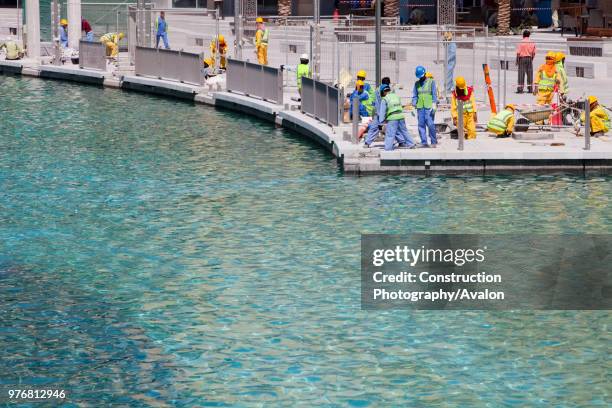 Construction workers working near the Burj Dubai in Dubai.