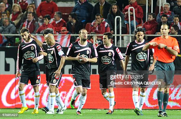 Deportivo Coruna's forward Adrian Lopez celebrates after scoring against Sevilla during a Spanish league football match at Sanchez Pizjuan stadium in...