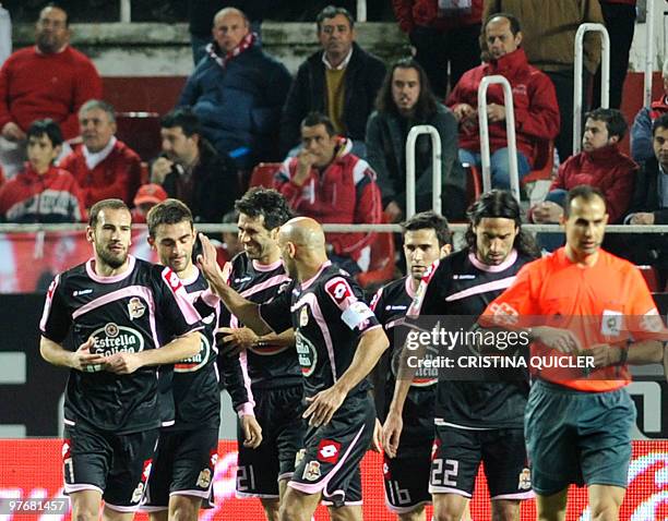 Deportivo Coruna's forward Adrian Lopez celebrates after scoring against Sevilla during a Spanish league football match at Sanchez Pizjuan stadium in...