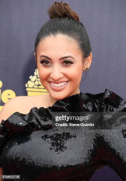 Francia Raisa arrives at the 2018 MTV Movie And TV Awards at Barker Hangar on June 16, 2018 in Santa Monica, California.