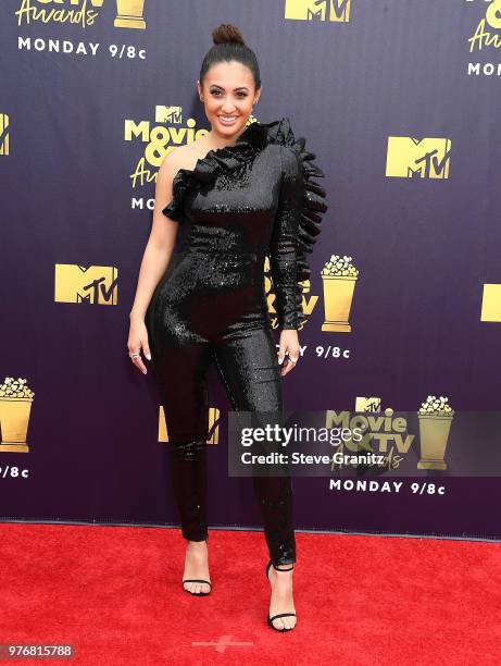 Francia Raisa arrives at the 2018 MTV Movie And TV Awards at Barker Hangar on June 16, 2018 in Santa Monica, California.