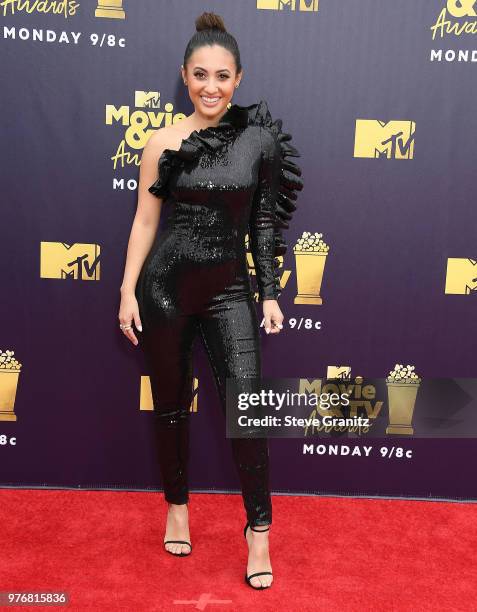 Francia Raisa arrives at the 2018 MTV Movie And TV Awards at Barker Hangar on June 16, 2018 in Santa Monica, California.