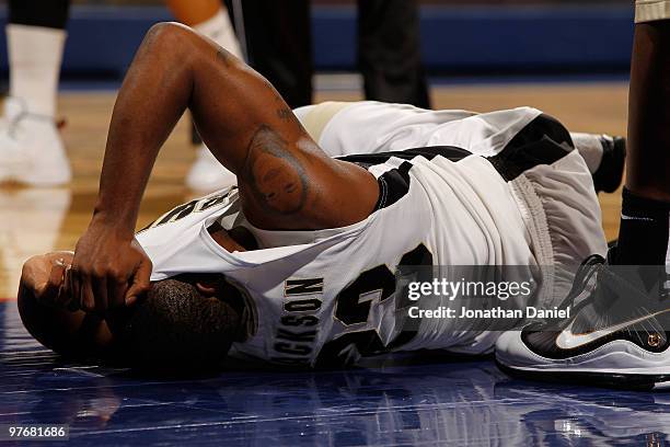 Guard Lewis Jackson of the Purdue Boilermakers lays on the court after injuring himself during the game against the Minnesota Golden Gophers in the...