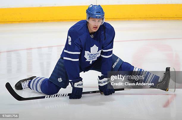 Luke Schenn of the Toronto Maple Leafs stretches in the warm-up prior to a game against the Edmonton Oilers on March 13, 2010 at the Air Canada...