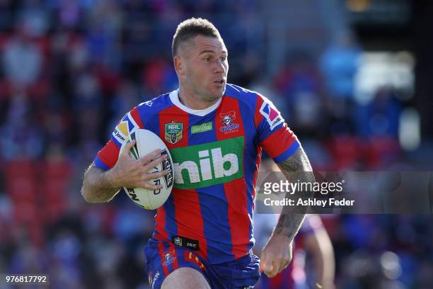 Shaun Kenny-Dowall of the Knights runs the ball during the round 15 NRL match between the Newcastle Knights and the Melbourne Storm at McDonald Jones...
