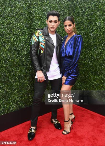 Internet personality Manny Mua and Laura Lee attend the 2018 MTV Movie And TV Awards at Barker Hangar on June 16, 2018 in Santa Monica, California.