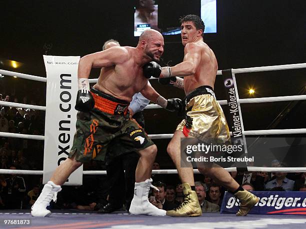 Marco Huck of Germany and Adam Richards of the U.S. Exchange punches during their WBO World Championship Cruiserweight title fight at the...