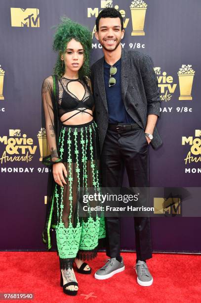 Actor Justice Smith and singer Cameo Adele attend the 2018 MTV Movie And TV Awards at Barker Hangar on June 16, 2018 in Santa Monica, California.