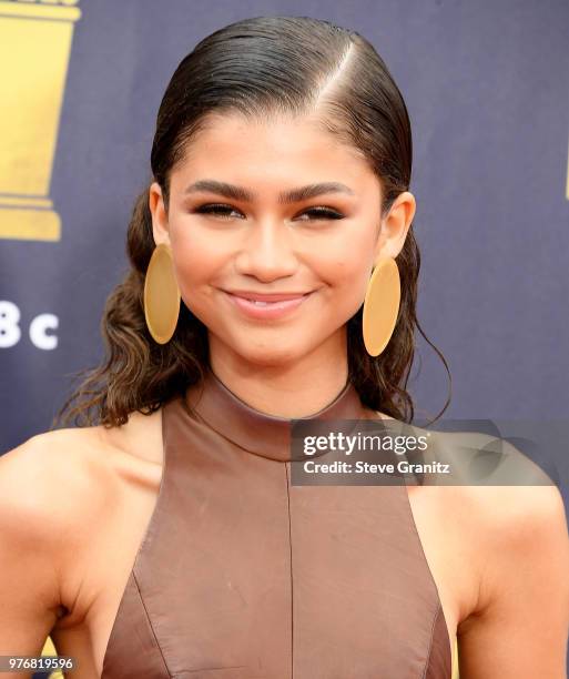 Zendaya arrives at the 2018 MTV Movie And TV Awards at Barker Hangar on June 16, 2018 in Santa Monica, California.