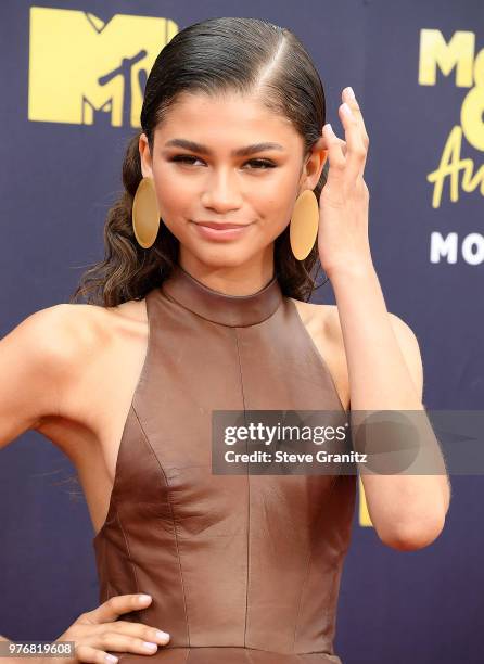 Zendaya arrives at the 2018 MTV Movie And TV Awards at Barker Hangar on June 16, 2018 in Santa Monica, California.