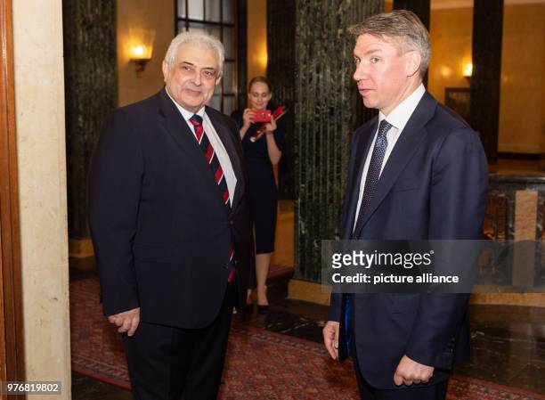 April 2018, Germany, Berlin: Russian ambassador to Germany Sergey Nechayev and Alexey Sorokin , the chairman of the organising committee for the 2018...