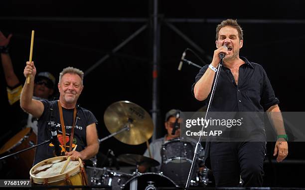 Argentinian musicians Vicentico , singer of Los Fabulosos Cadillacs band, and Leon Gieco, perform during the "Argentina embraces Chile" solidarity...