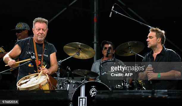 Argentinian musicians Vicentico , singer of Los Fabulosos Cadillacs band, and Leon Gieco, perform during the "Argentina embraces Chile" solidarity...