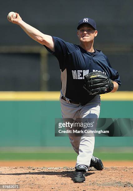 Chad Gaudin of the New York Yankees pitches against the Detroit Tigers during a spring training game at Joker Marchant Stadium on March 13, 2010 in...