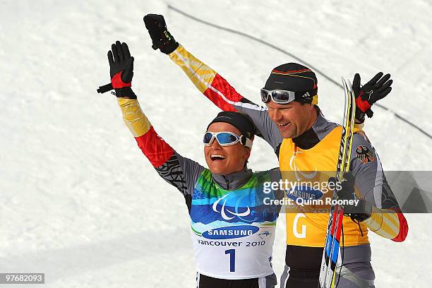 Verena Bentele and her guide Thomas Friedrich of Germany celebrate winning the Women's 3km Pursuit Visually Impaired Biathlon on Day 2 of the 2010...