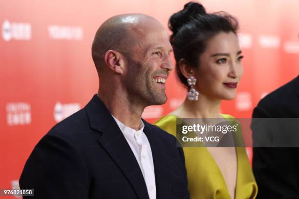 English actor Jason Statham and Chinese actress Li Bingbing arrive at red carpet during the opening ceremony of the 21st Shanghai International Film...